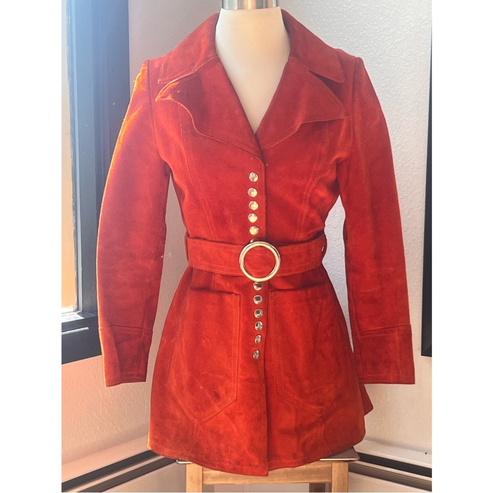 A vintage orange leather women's jacket. It is in great condition.